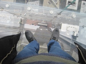 Standing on the glass ledge